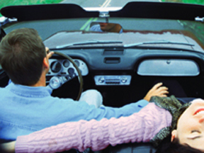 Couple Taking a Spin in a Convertible