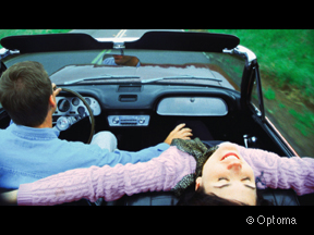 Couple Taking a Spin in a Convertible