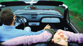 Couple Taking a Spin in a Convertible